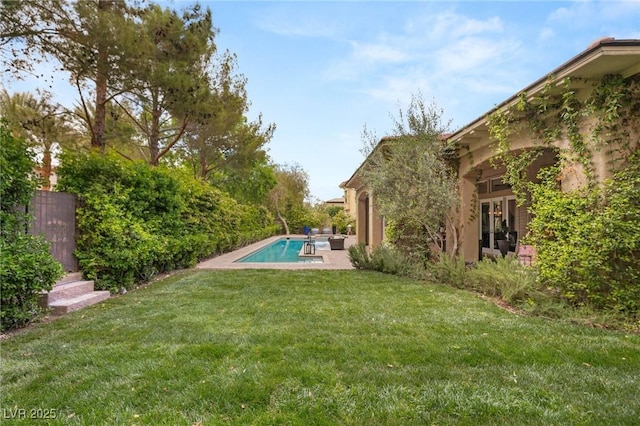 view of yard with an outdoor pool and a patio area