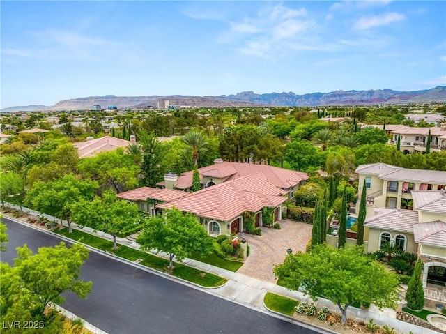 drone / aerial view with a residential view and a mountain view