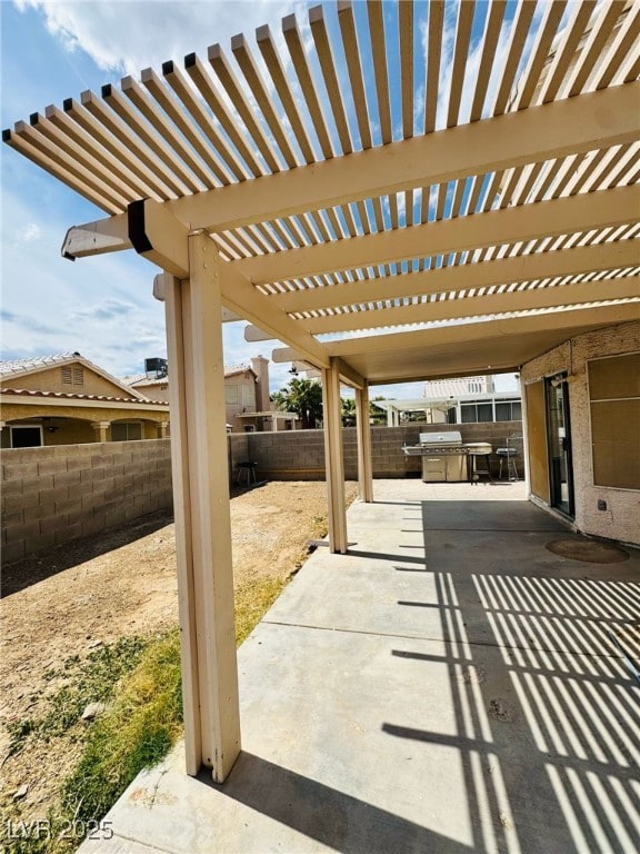 5711 Roundrock Dr, Las Vegas, NV 89142 - view of patio with a pergola, a fenced backyard, and a grill