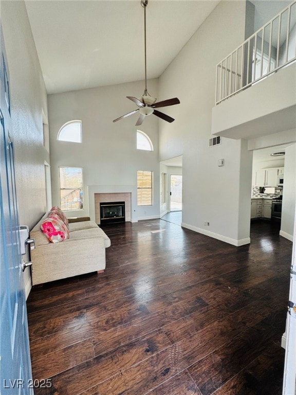 5711 Roundrock Dr, Las Vegas, NV 89142 - living area featuring visible vents, a towering ceiling, wood finished floors, and a wealth of natural light