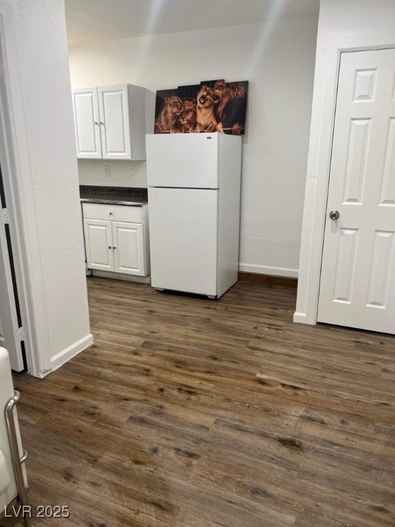5711 Roundrock Dr, Las Vegas, NV 89142 - interior space with baseboards and dark wood finished floors