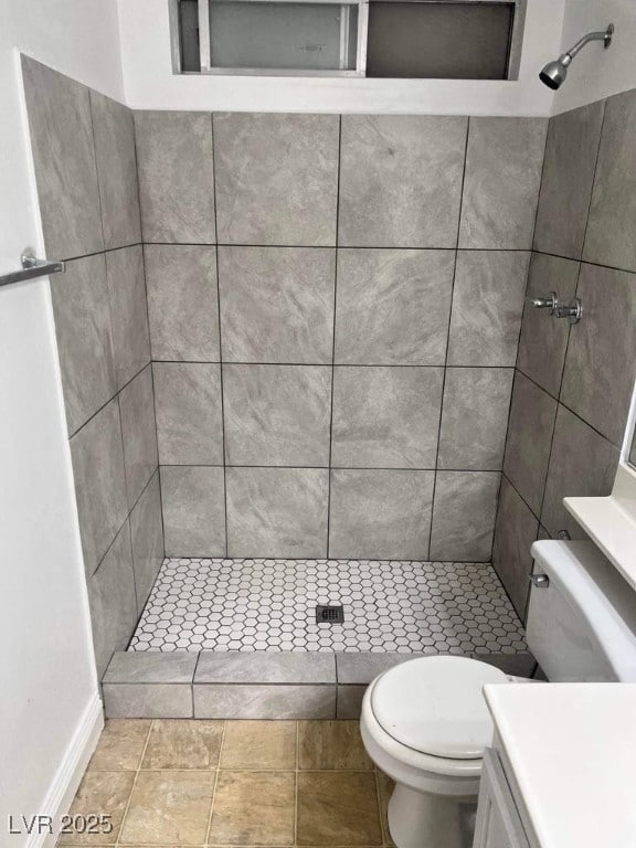 5711 Roundrock Dr, Las Vegas, NV 89142 - full bathroom featuring vanity, toilet, baseboards, and a stall shower