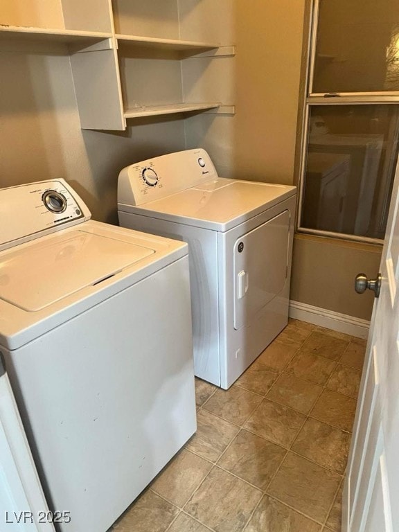 5711 Roundrock Dr, Las Vegas, NV 89142 - laundry room with laundry area, baseboards, and washing machine and clothes dryer