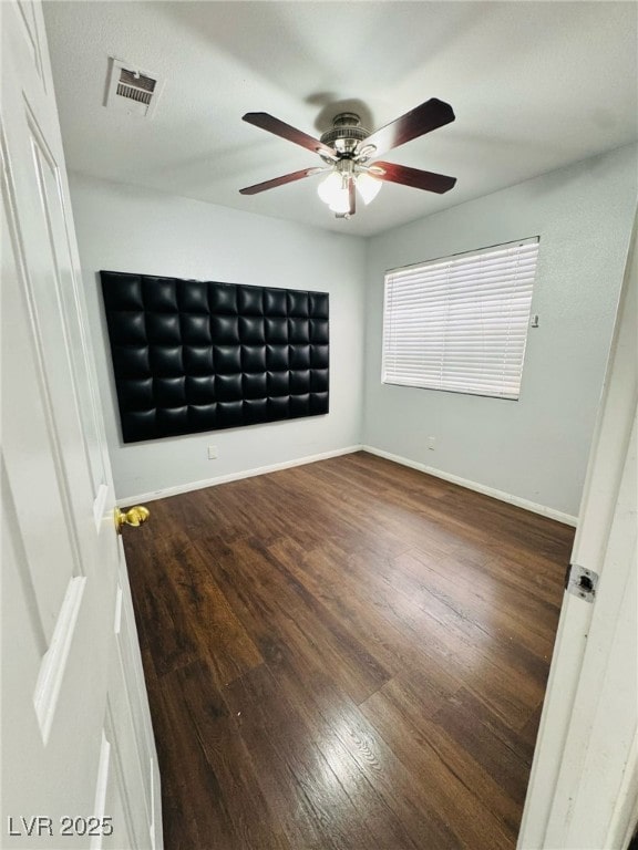 5711 Roundrock Dr, Las Vegas, NV 89142 - empty room with baseboards, ceiling fan, wood finished floors, and visible vents
