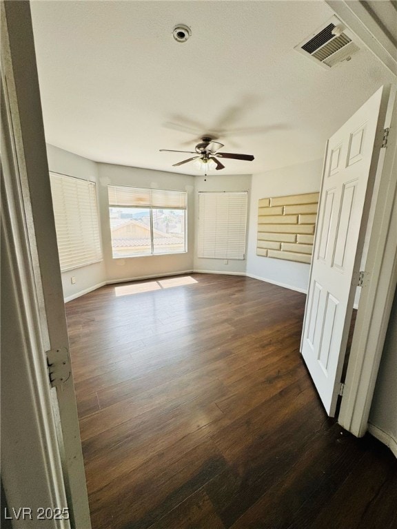 5711 Roundrock Dr, Las Vegas, NV 89142 - unfurnished bedroom featuring a ceiling fan, baseboards, visible vents, and dark wood-type flooring