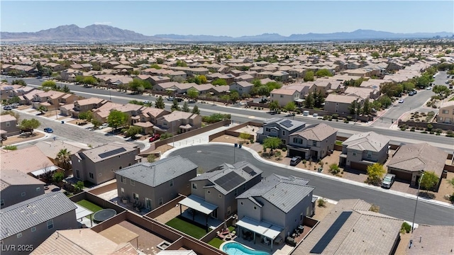 aerial view of residential area featuring a mountain backdrop