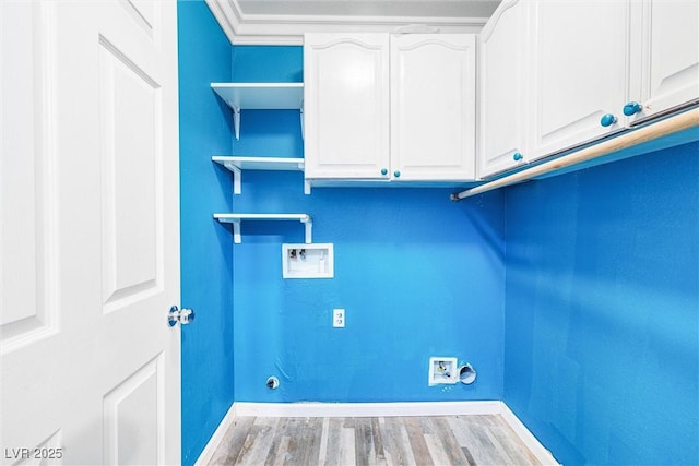 laundry area with washer hookup, baseboards, cabinet space, and wood finished floors