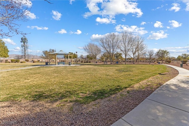 surrounding community featuring a yard, a gazebo, and playground community