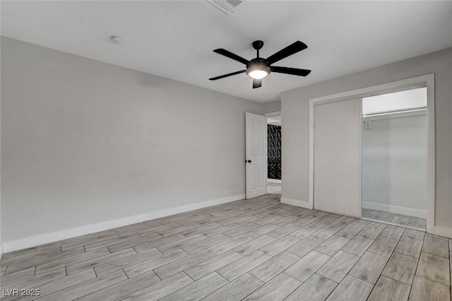 unfurnished bedroom with ceiling fan, visible vents, baseboards, a closet, and light wood finished floors