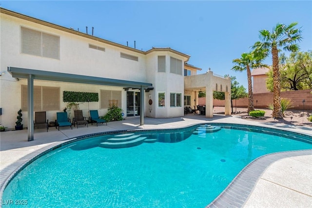 view of pool featuring a patio, fence, and a fenced in pool