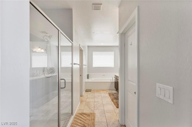 full bath featuring visible vents, a shower stall, and a bath