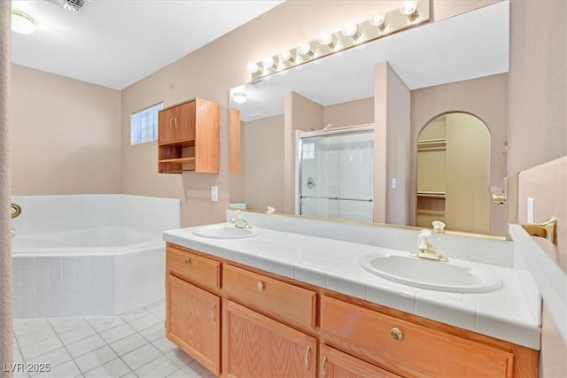 880 Autumn Canyon Way, Henderson, NV 89002 - full bathroom with a bath, a shower stall, a sink, and tile patterned flooring