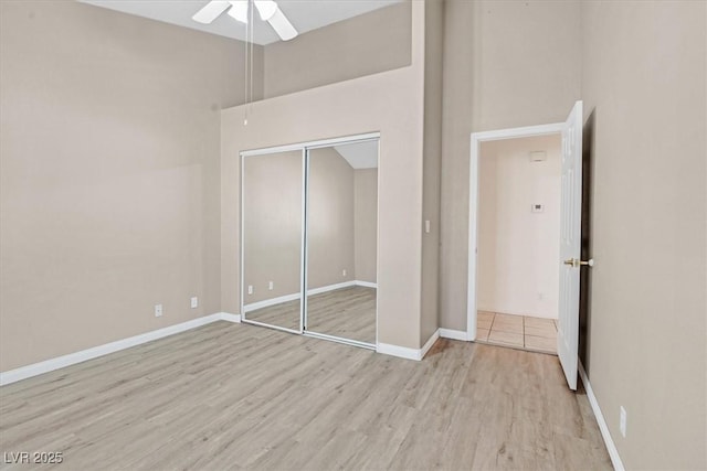 880 Autumn Canyon Way, Henderson, NV 89002 - unfurnished bedroom with baseboards, a ceiling fan, a closet, and wood finished floors
