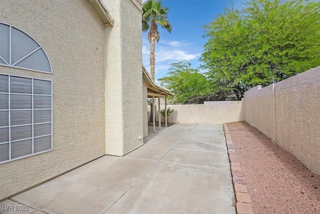 880 Autumn Canyon Way, Henderson, NV 89002 - view of home's exterior featuring a patio, a fenced backyard, and stucco siding