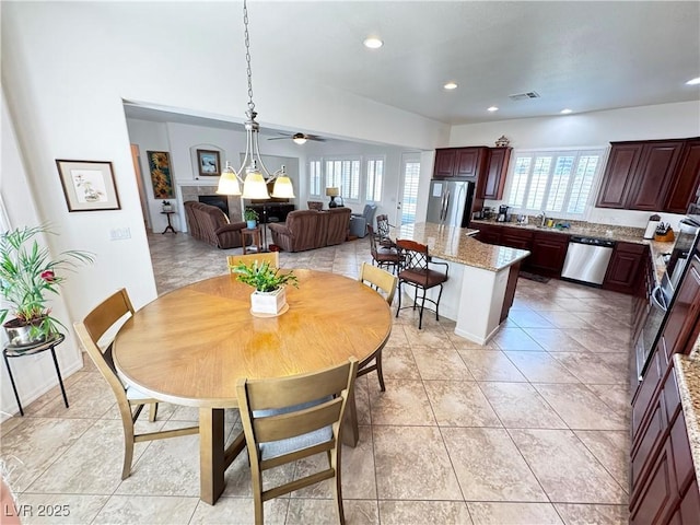 dining room featuring a ceiling fan, visible vents, light tile patterned floors, and recessed lighting