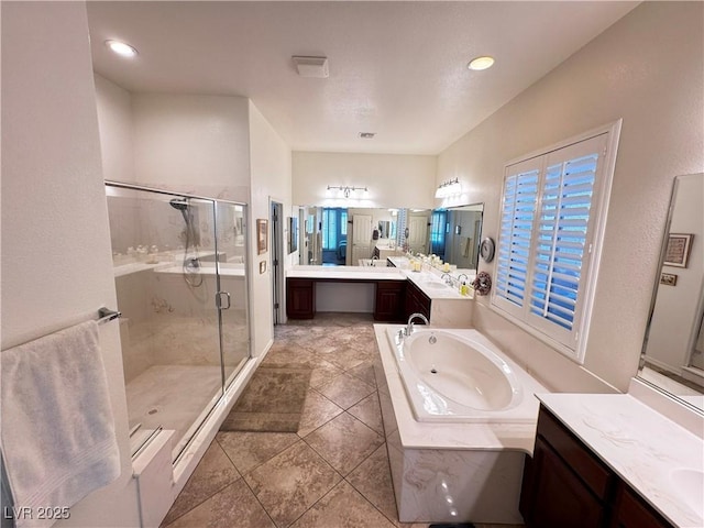 6134 Burleson Ranch Rd, Las Vegas, NV 89131 - bathroom with a jetted tub, a shower stall, vanity, tile patterned floors, and recessed lighting