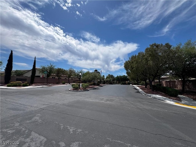 6134 Burleson Ranch Rd, Las Vegas, NV 89131 - view of asphalt street featuring curbs, sidewalks, and street lighting