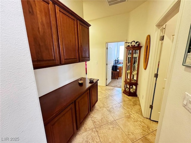 6134 Burleson Ranch Rd, Las Vegas, NV 89131 - hall featuring light tile patterned flooring and lofted ceiling