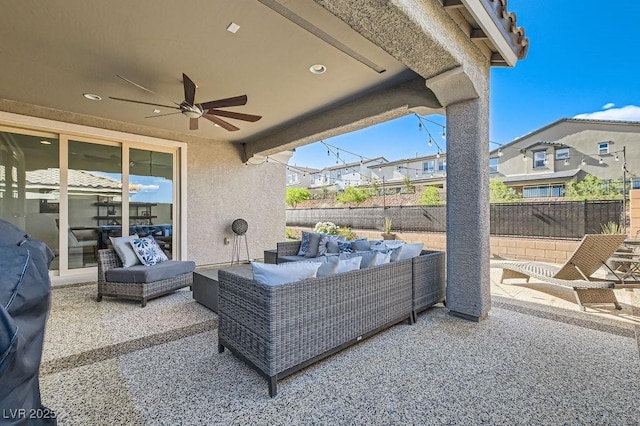 view of patio / terrace with ceiling fan, fence, and an outdoor hangout area