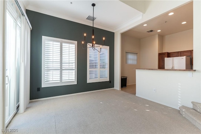 interior space with a chandelier, visible vents, light carpet, and recessed lighting