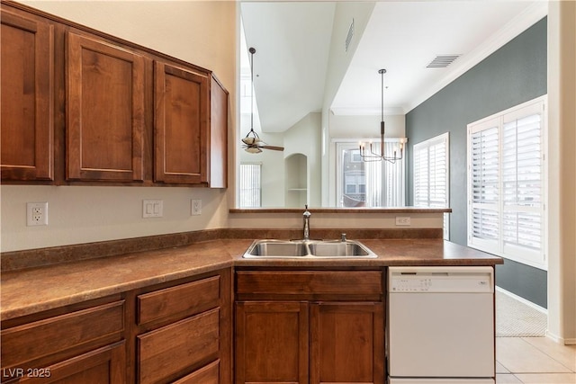 kitchen featuring a sink, a peninsula, dishwasher, and dark countertops