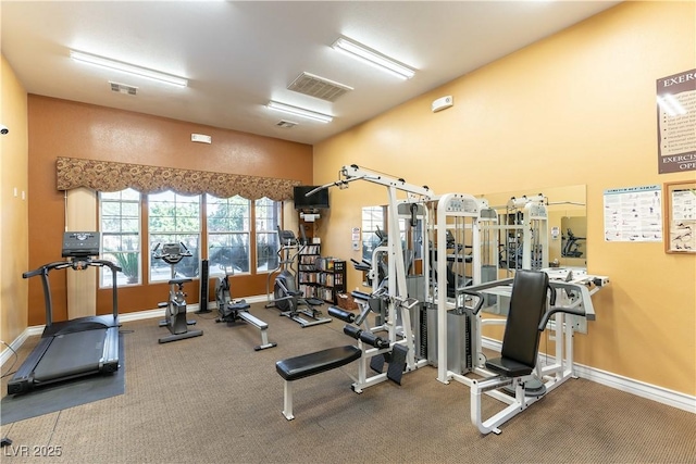 workout area featuring baseboards and visible vents