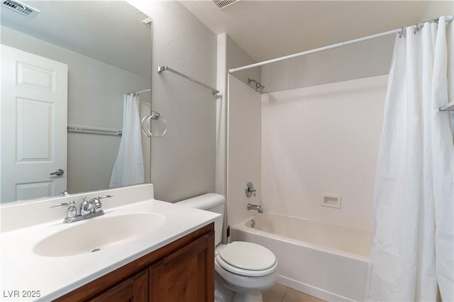 bathroom featuring vanity, shower / bath combo with shower curtain, toilet, tile patterned floors, and visible vents