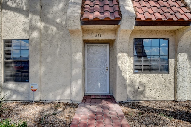 611 Spyglass Ln, Las Vegas, NV 89107 - property entrance with a tiled roof and stucco siding