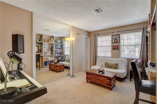 611 Spyglass Ln, Las Vegas, NV 89107 - living area with carpet floors, a textured ceiling, and visible vents
