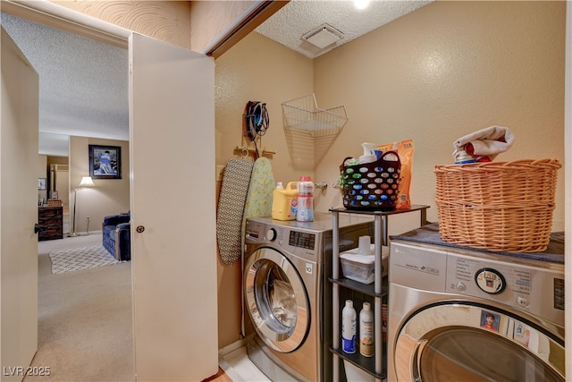611 Spyglass Ln, Las Vegas, NV 89107 - laundry room with laundry area, a textured ceiling, visible vents, separate washer and dryer, and carpet