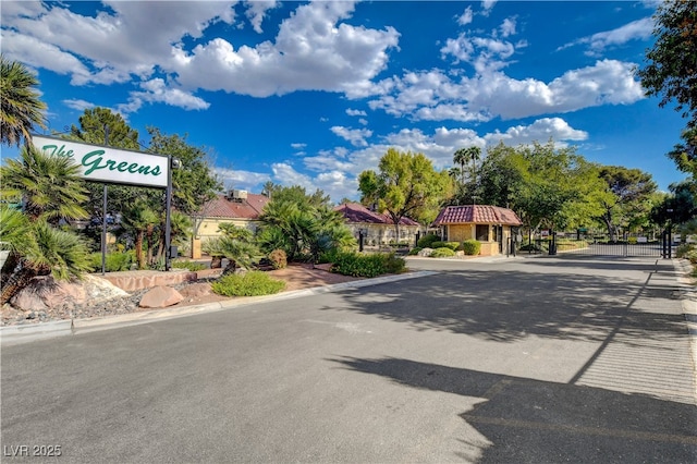 611 Spyglass Ln, Las Vegas, NV 89107 - view of road with a gated entry, a gate, and curbs