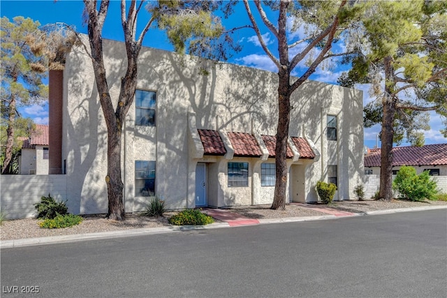 611 Spyglass Ln, Las Vegas, NV 89107 - view of front of home with stucco siding and a tile roof