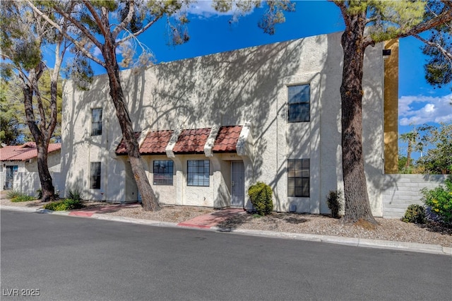 611 Spyglass Ln, Las Vegas, NV 89107 - view of front facade with stucco siding and a tile roof