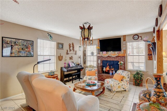 611 Spyglass Ln, Las Vegas, NV 89107 - tiled living area featuring baseboards, a fireplace, and a textured ceiling