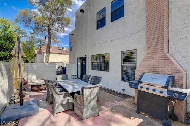 611 Spyglass Ln, Las Vegas, NV 89107 - view of patio / terrace featuring outdoor dining area, a gate, fence, and grilling area