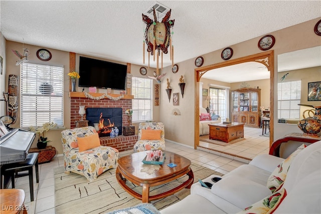 611 Spyglass Ln, Las Vegas, NV 89107 - living area featuring plenty of natural light, tile patterned flooring, and a textured ceiling