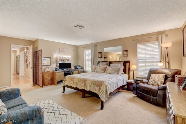 611 Spyglass Ln, Las Vegas, NV 89107 - bedroom featuring visible vents, a textured ceiling, and light carpet