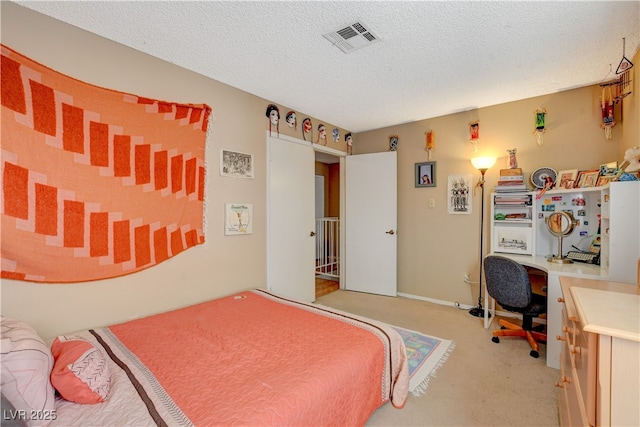 611 Spyglass Ln, Las Vegas, NV 89107 - bedroom featuring a textured ceiling, visible vents, and light carpet