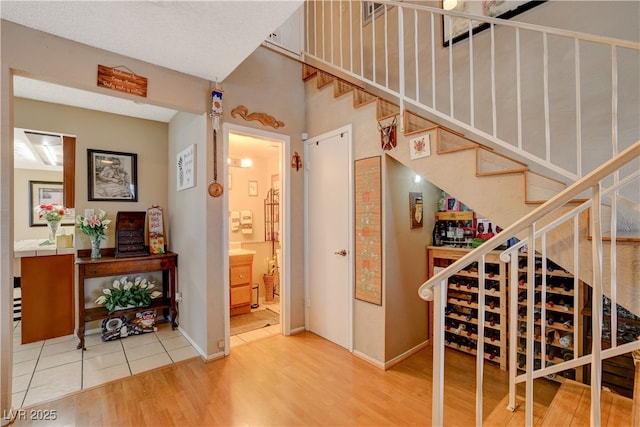 611 Spyglass Ln, Las Vegas, NV 89107 - staircase featuring baseboards and wood finished floors