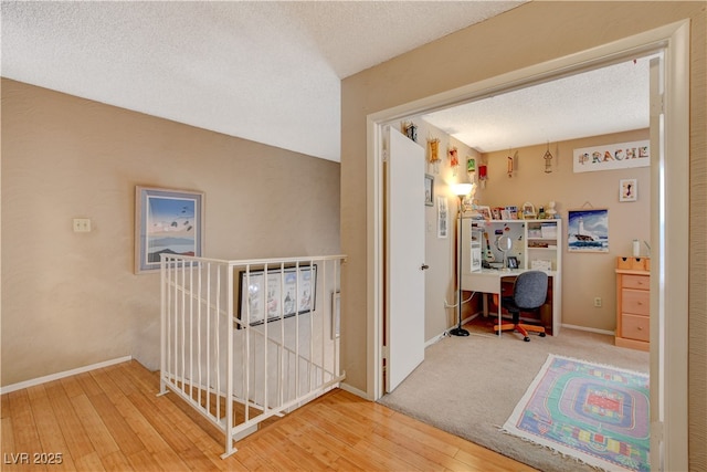 611 Spyglass Ln, Las Vegas, NV 89107 - corridor featuring a textured ceiling, baseboards, and hardwood / wood-style flooring