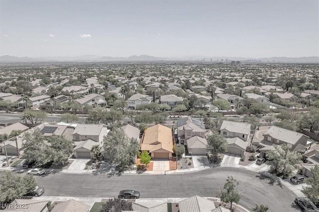 birds eye view of property with a mountain view and a residential view