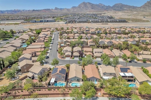 drone / aerial view featuring a mountain view and a residential view