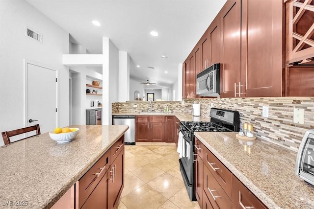 kitchen with visible vents, a sink, appliances with stainless steel finishes, and tasteful backsplash