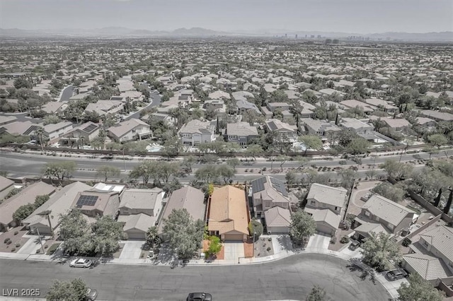 drone / aerial view featuring a residential view and a mountain view