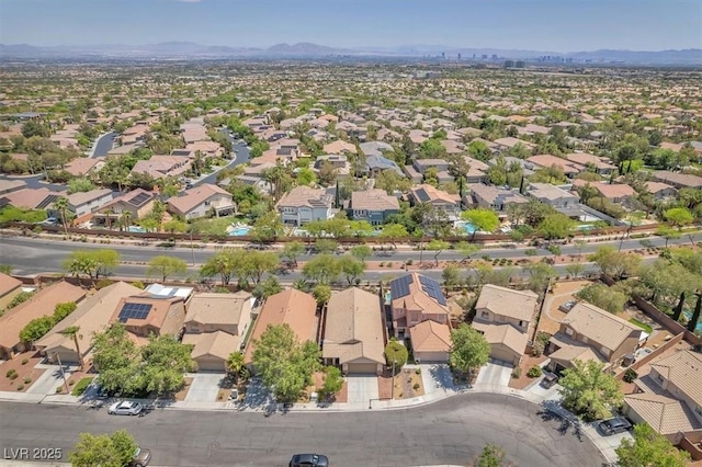 drone / aerial view with a residential view and a mountain view