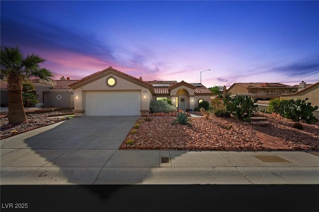 2725 Byron Dr, Las Vegas, NV 89134 - mediterranean / spanish-style home featuring concrete driveway, a garage, stucco siding, and a tile roof
