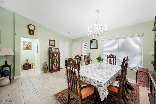 2725 Byron Dr, Las Vegas, NV 89134 - dining space with a chandelier, vaulted ceiling, baseboards, and light tile patterned flooring