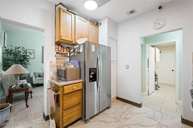 2725 Byron Dr, Las Vegas, NV 89134 - kitchen with stainless steel appliances, light countertops, and baseboards
