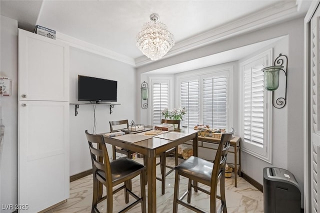 2725 Byron Dr, Las Vegas, NV 89134 - dining area with light marble finish flooring, healthy amount of natural light, a chandelier, baseboards, and crown molding