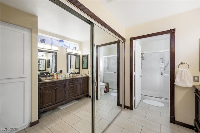 2725 Byron Dr, Las Vegas, NV 89134 - full bathroom with toilet, double vanity, a stall shower, and tile patterned flooring